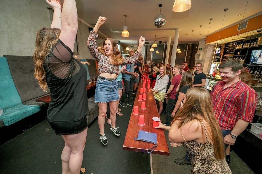 Nomads Capital Backpackers - Wellington (Adults Only) Hostel Exterior photo A game of beer pong